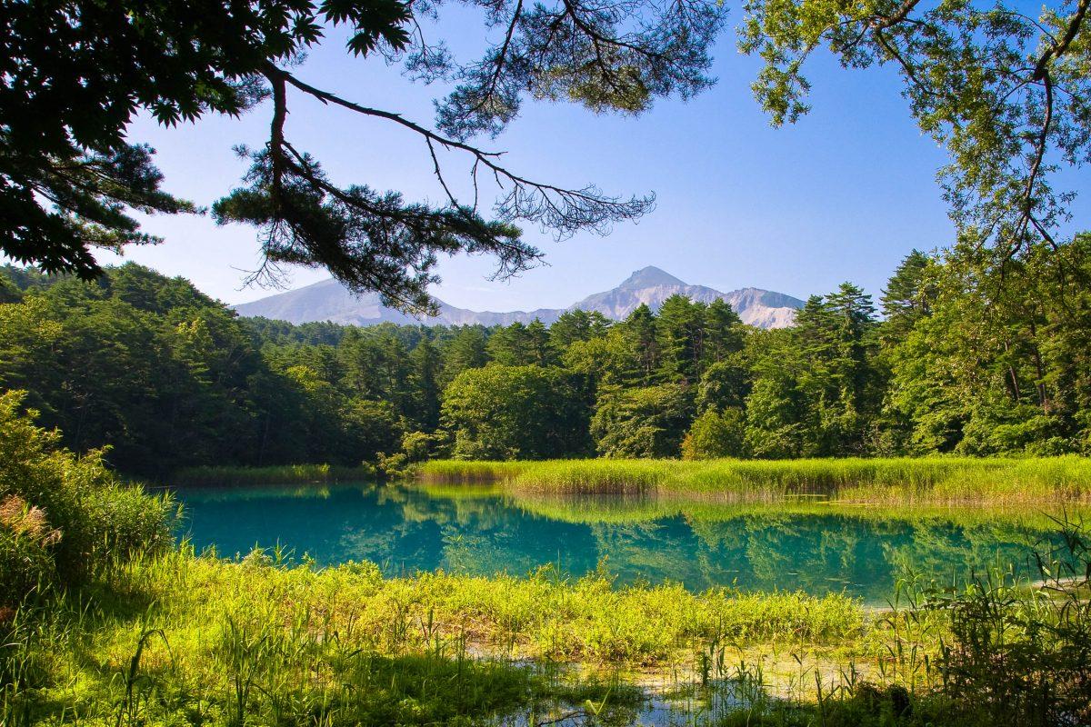 The mountain world of Bandai Asahi National Park in Japan is home to crystal-clear lakes and lush vegetation - © Luftikus / Shutterstock